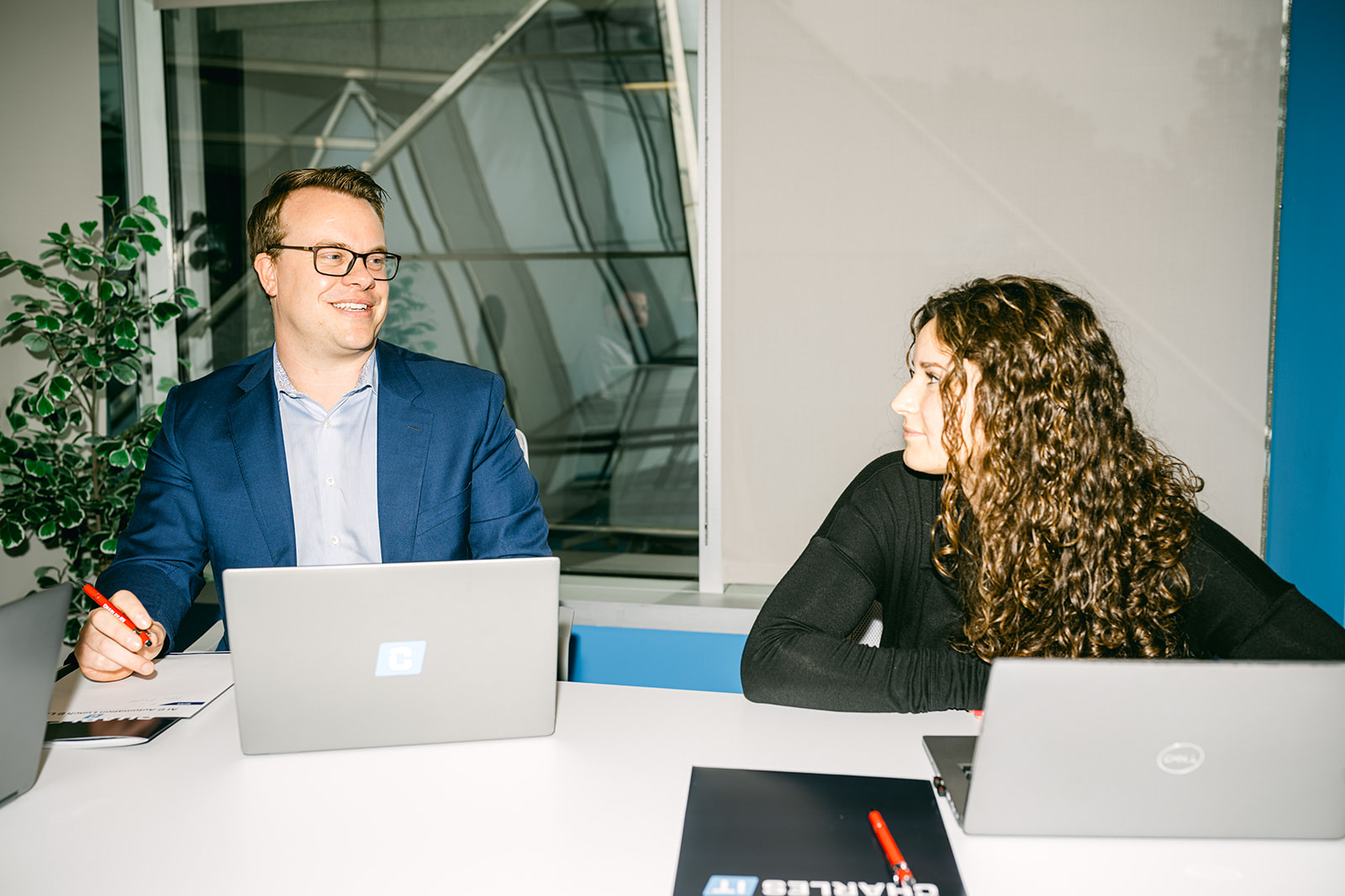 Man and woman in professional conference room