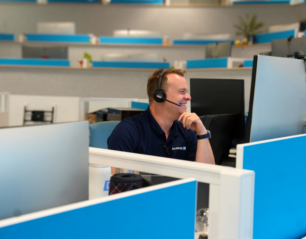 Charles IT CEO speaking with a client from the Middletown office