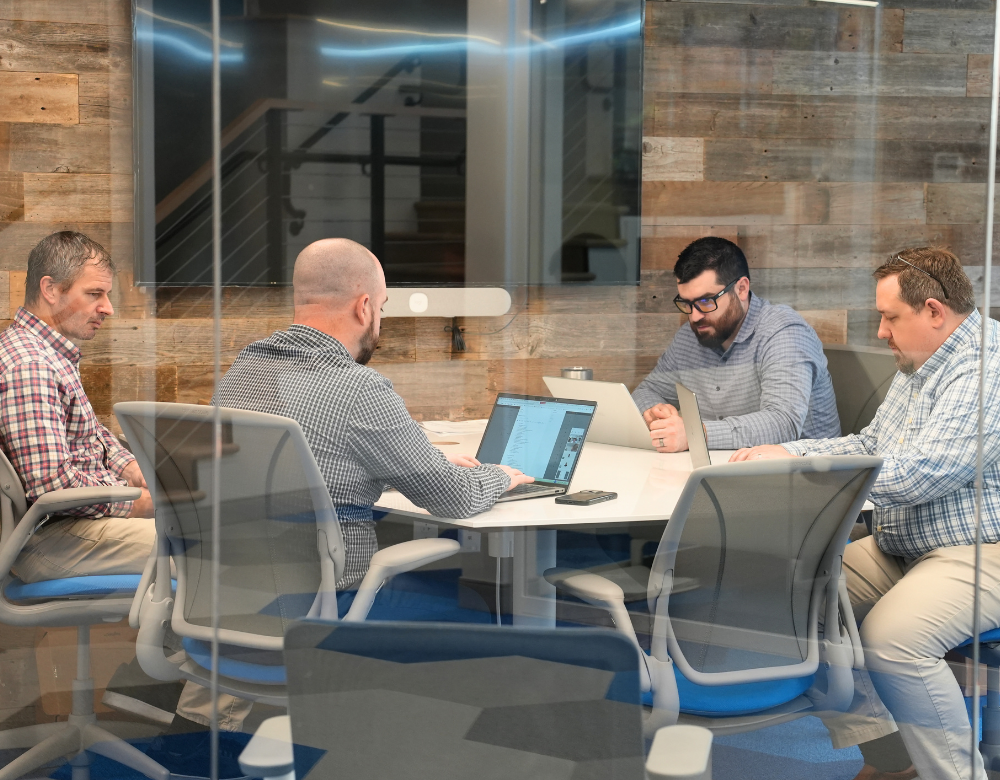 Charles IT team collaborating on cybersecurity and compliance planning