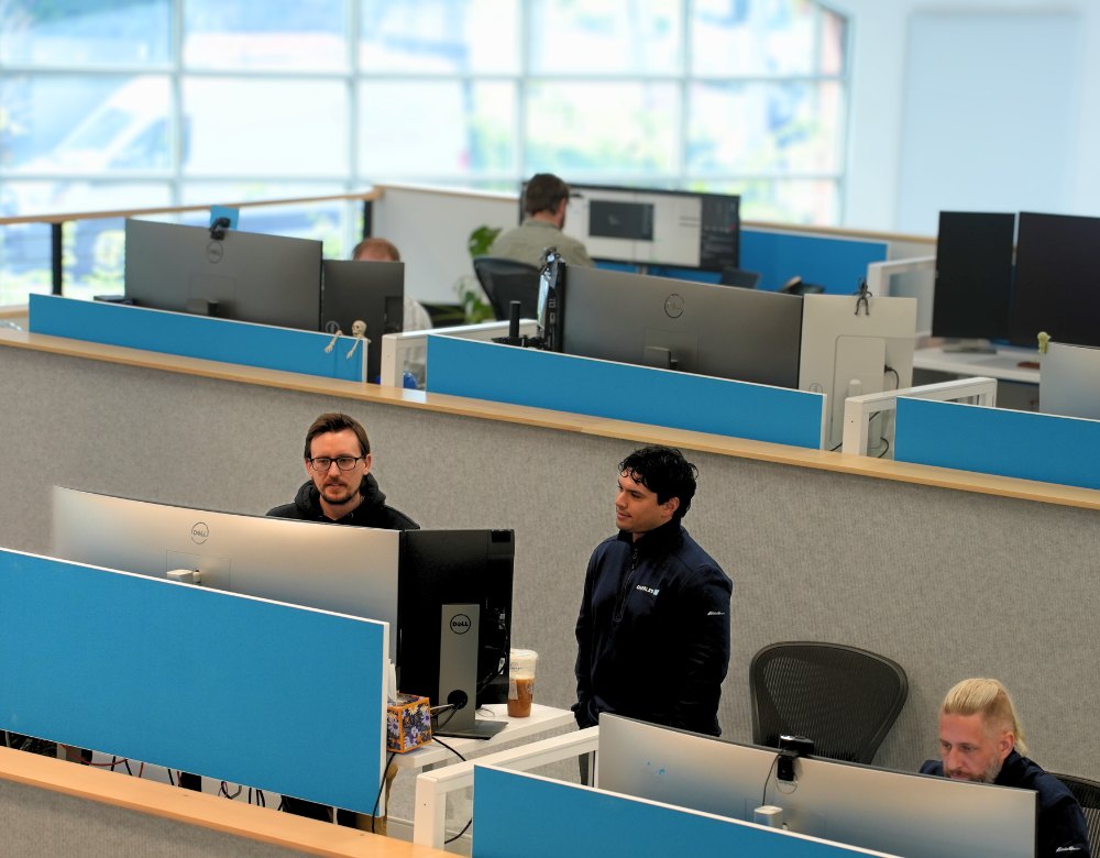 Charles IT support professionals working together to resolve technology issues