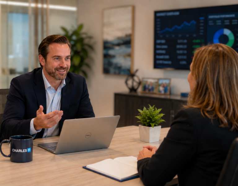 Technology consultant meeting with a wealth management professional in a financial advisory office