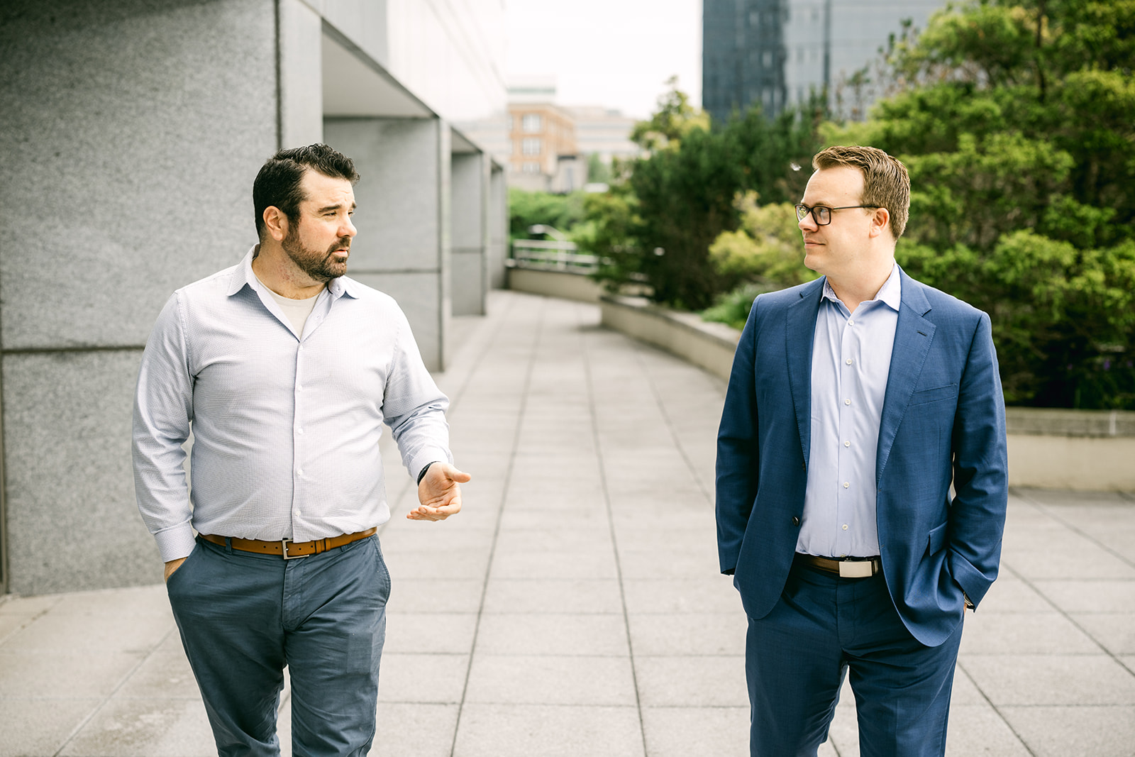 Two Charles IT professionals walking and discussing business technology