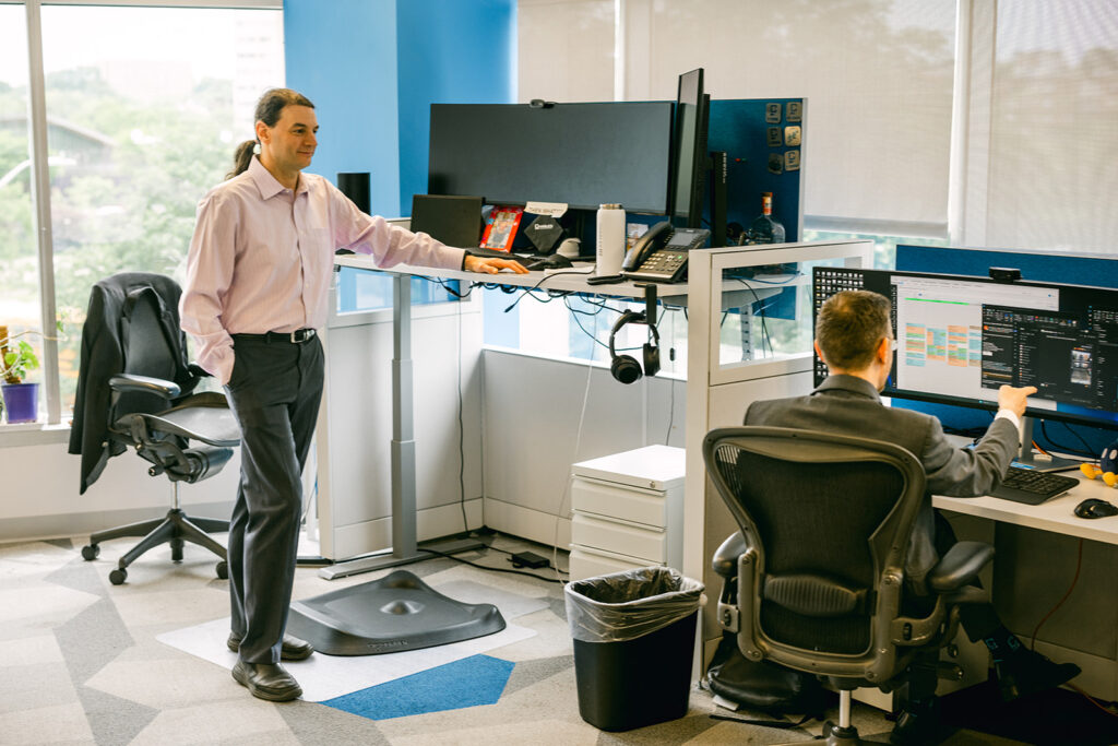 Orthopedic care team consulting on secure technology usage and support for a medical practice