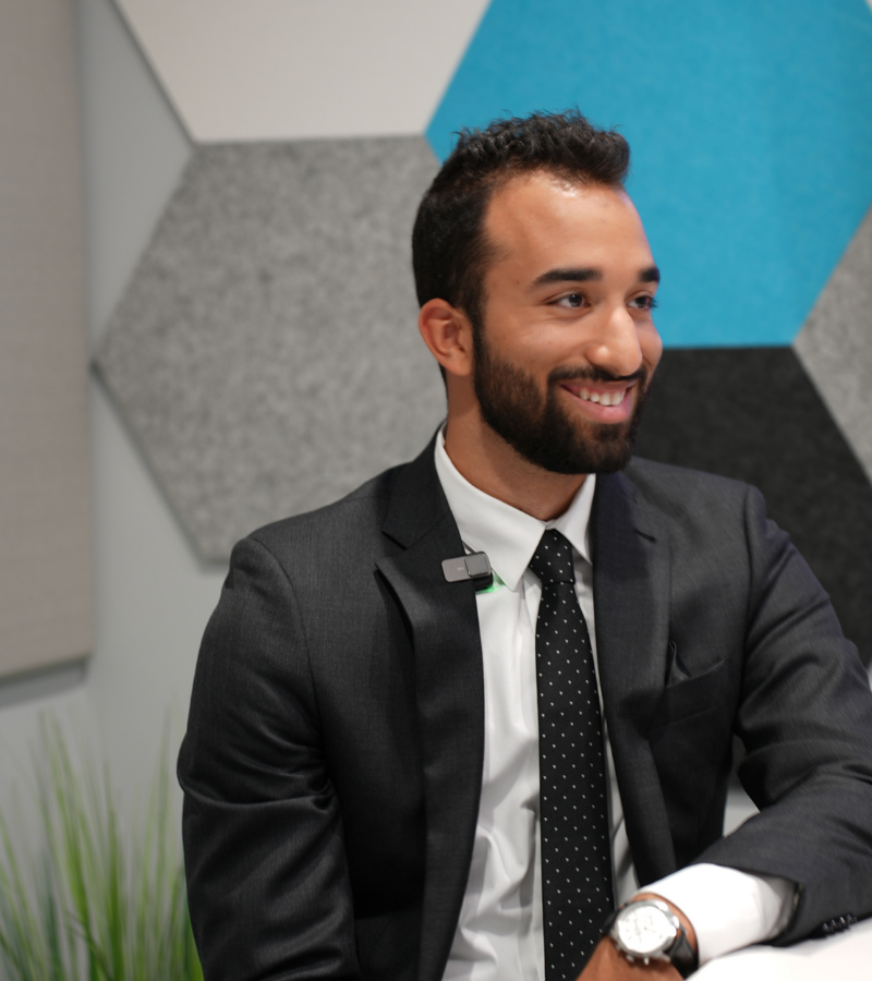 Charles IT team member smiling during an interview in a conference room